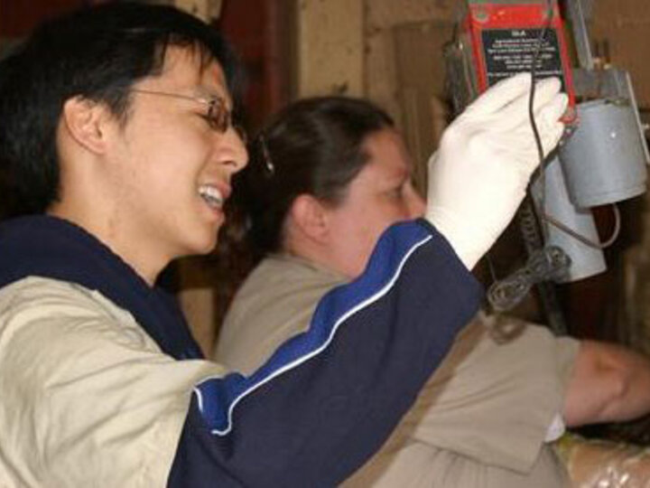 Student working with a machine.