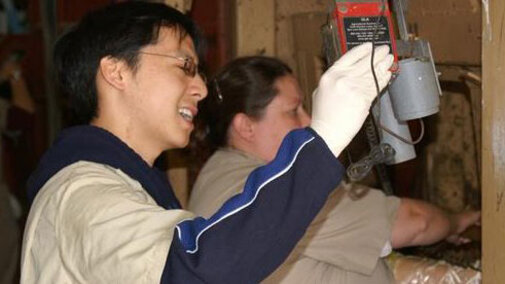 Student working with a machine.