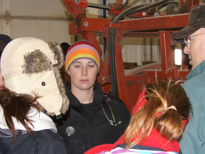 Students and teacher talking in a group.